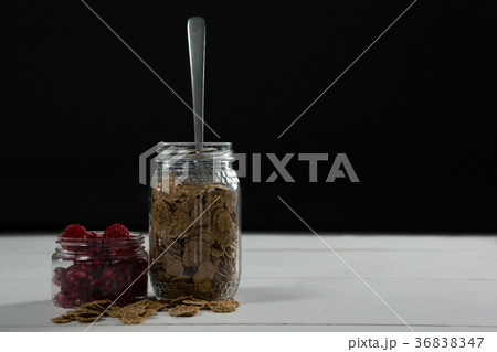 Raspberry and wheat flakes in glass jar 36838347