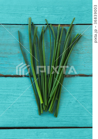 Garlic chives on wooden table 36839003