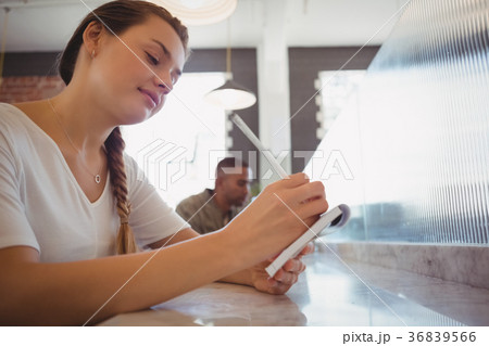 Waitress taking order at counter Waitress taking order at counter 36839566