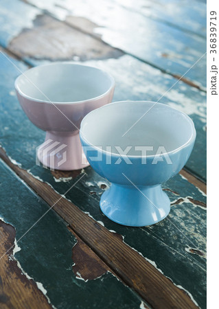 Two ceramic bowls on wooden table Two ceramic bowls on wooden table 36839719