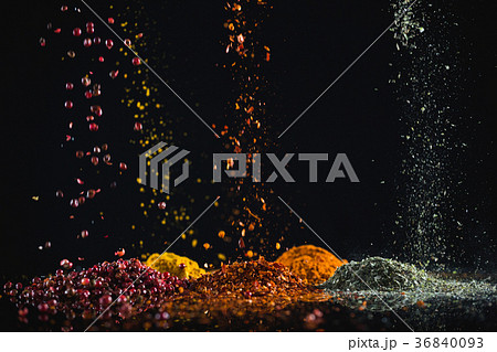 Powdered spices against black background Powdered spices against black background 36840093