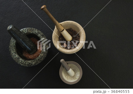 Sea salt and black salt in mortar pestle 36840555