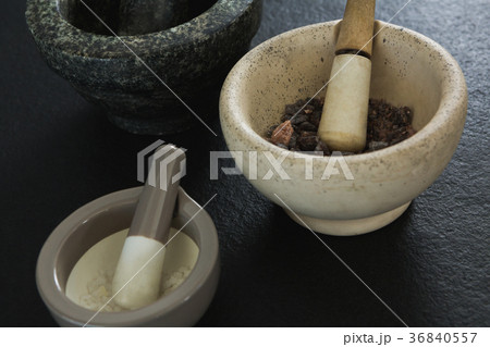 Sea salt and black salt in mortar pestle 36840557