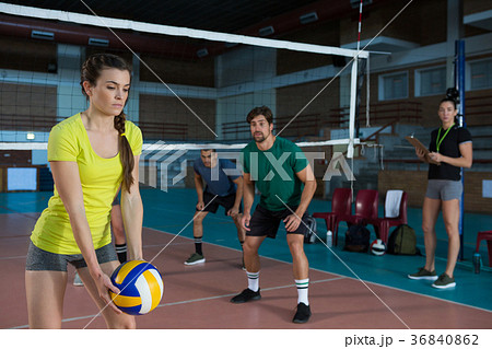 Players playing volleyball at court Players playing volleyball at court 36840862