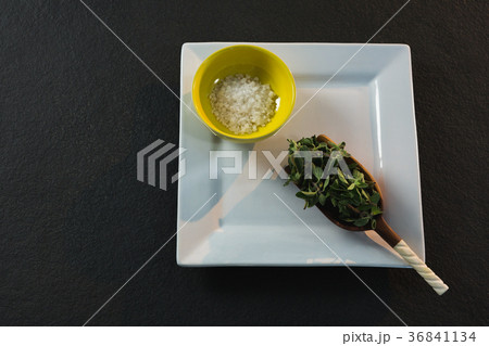 Herb in a scoop with salt Herb in a scoop with salt 36841134