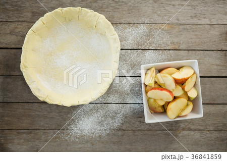 Overhead view of pastry dough and apple slices in container Overhead view of pastry dough and apple slices in container 36841859