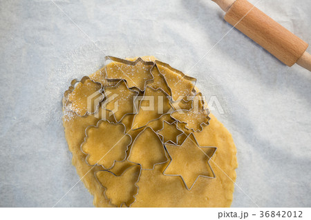Overhead view of various shape pastry cutter on rolled dough Overhead view of various shape pastry cutter on rolled dough 36842012