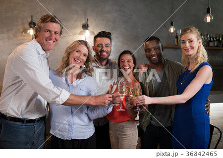 Portrait of happy friends toasting champagne 36842465