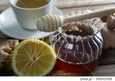 Close up of fresh honey and lemon with ginger tea 36842689