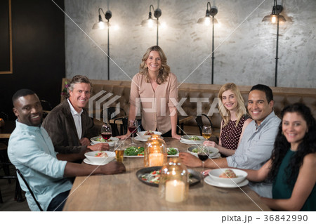 Happy friends dining in restaurant Happy friends dining in restaurant 36842990