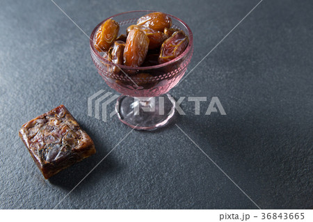 Dates fruits in glass bowl on slate 36843665