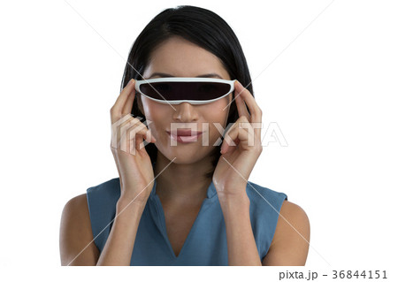Female executive using virtual reality headset Female executive using virtual reality headset 36844151