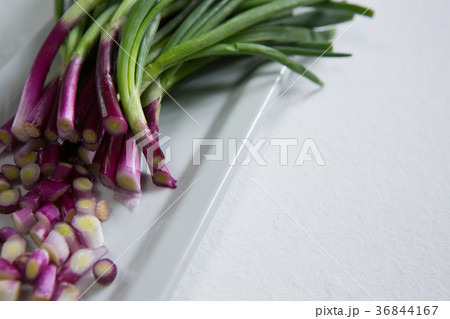 Chopped scallion on tray 36844167