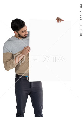 Handsome man looking at white blank sheet 36844168