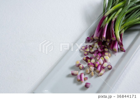 Chopped scallion on tray 36844171