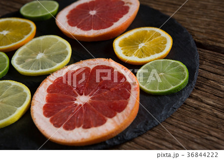 Various citrus slices in tray 36844222