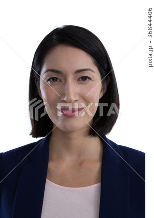 Confident businesswoman against white background 36844406