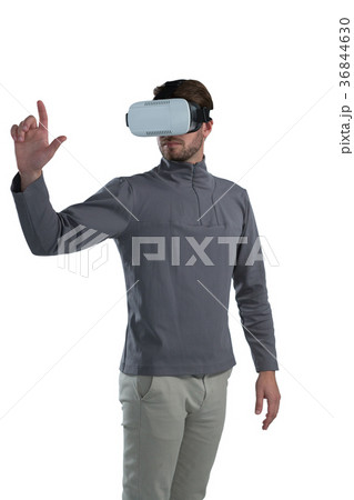 Man gesturing while using virtual reality headset 36844630