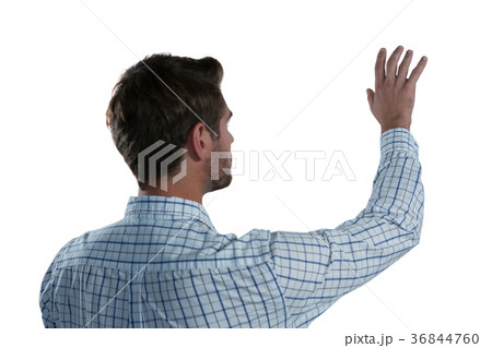 Man pretending to touch an invisible screen Man pretending to touch an invisible screen 36844760
