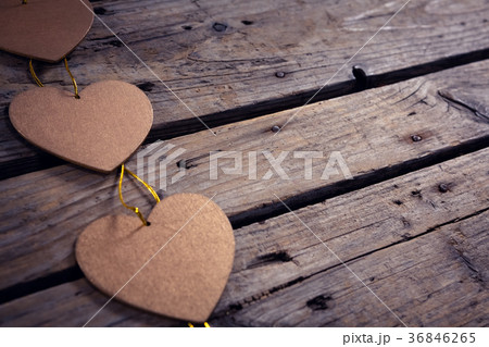 Heart shaped christmas decoration on wooden plank Heart shaped christmas decoration on wooden plank 36846265