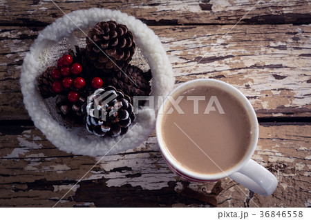 Coffee and christmas decoration on wooden plank 36846558