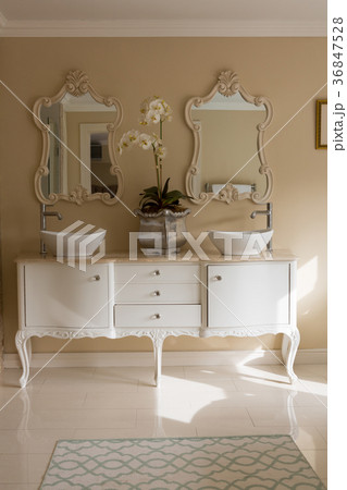Elegant sink and mirror in bathroom 36847528