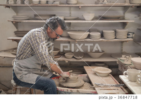 Male potter molding a clay Male potter molding a clay 36847718
