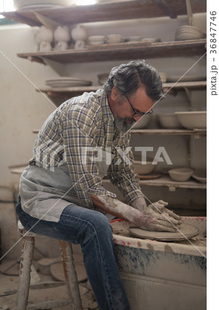 Male potter molding clay Male potter molding clay 36847746