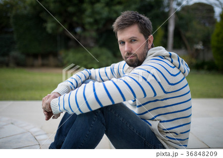 Man standing in the park 36848209