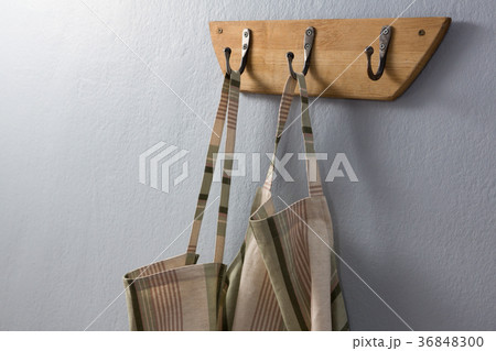 Aprons hanging on hook 36848300