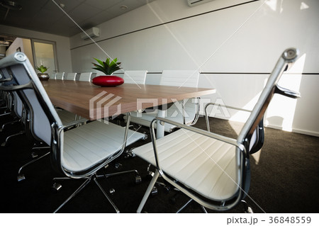 Empty chairs by conference table at office 36848559