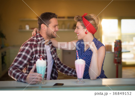 Couple romancing in restaurant 36849152