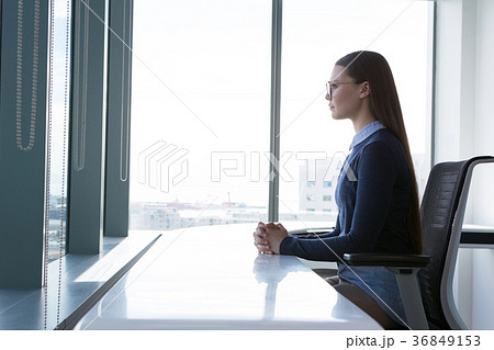 Female executive sitting at table 36849153
