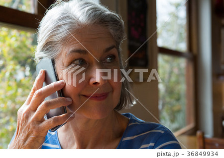 Senior woman talking on mobile phone 36849934
