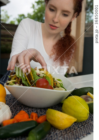 Woman eating mexican food 36850001