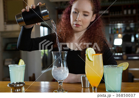 Waitress making a drink Waitress making a drink 36850037