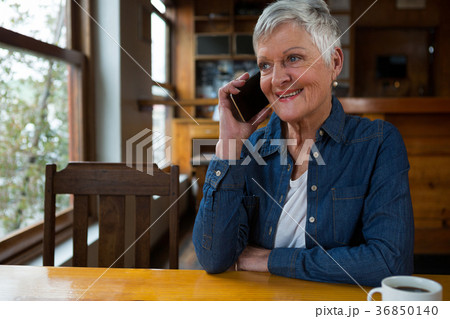 Senior woman talking on mobile phone 36850140