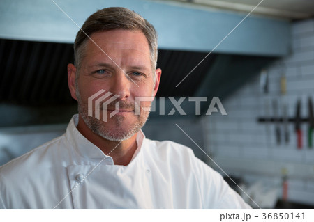 Male chef standing in commercial kitchen 36850141