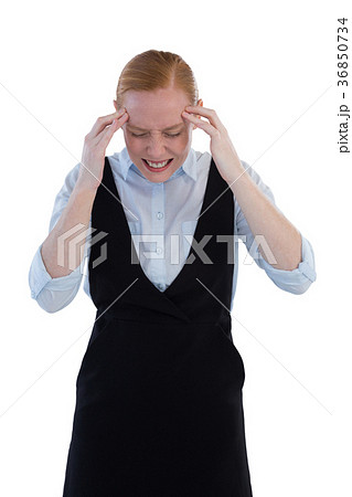 Female executive suffering from headache Female executive suffering from headache 36850734