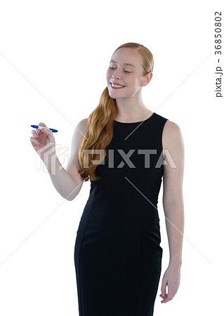 Female executive writing on invisible screen 36850802