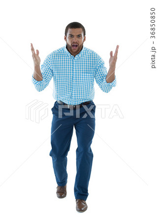 Male executive shouting against white background 36850850
