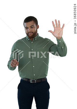 Male executive pretending to use an invisible screen 36850924