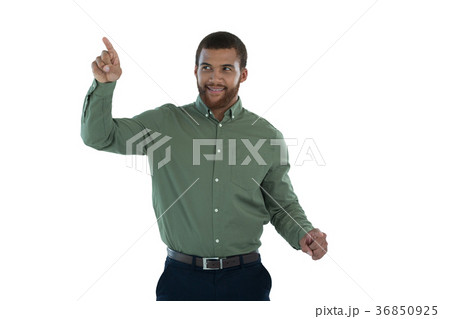 Male executive pretending to use an invisible screen 36850925