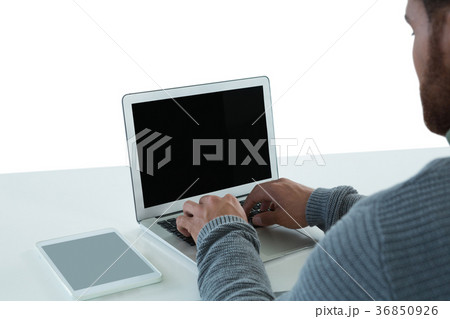 Male executive using laptop 36850926