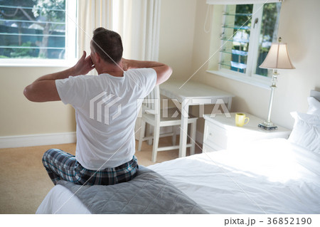Man yawning in his bed Man yawning in his bed 36852190