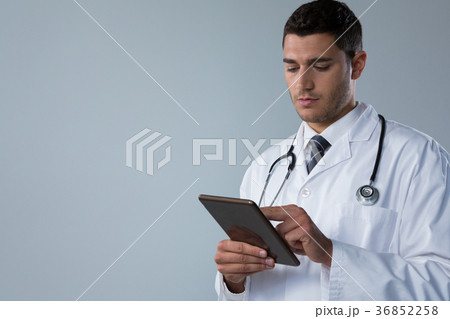 Doctor using a digital tablet Doctor using a digital tablet 36852258