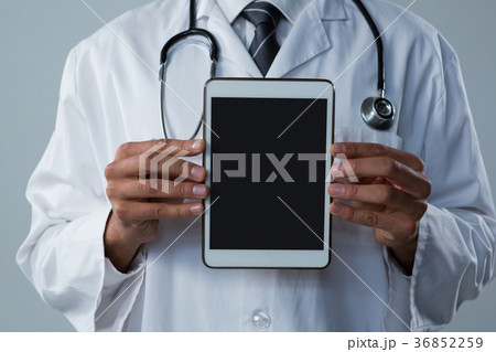 Doctor holding a digital tablet Doctor holding a digital tablet 36852259
