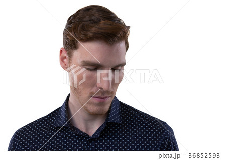 Male executive standing with eyes closed Male executive standing with eyes closed 36852593