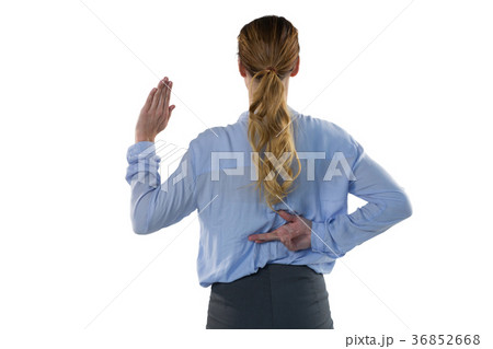 Female executive gesturing against white background 36852668