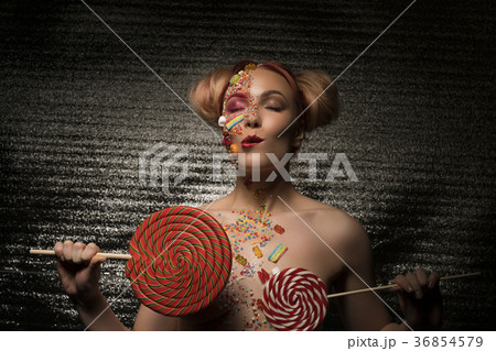 Nude blonde with lollipops in her hands 36854579